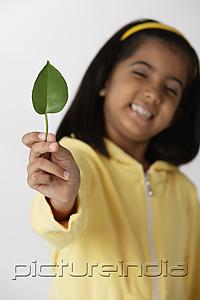PictureIndia - Girl holding leaf