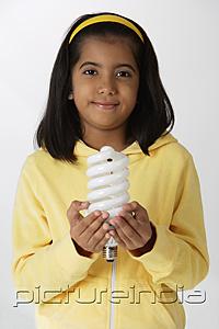 PictureIndia - Girl holding light bulb
