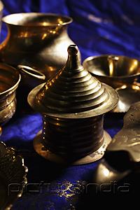 PictureIndia - Close up of bronze Indian containers and bowls