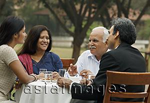Asia Images Group - family having meal outdoors