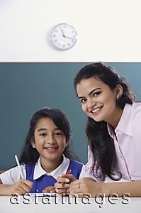 Asia Images Group - teacher and student smile at camera (close up)