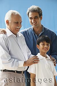 Asia Images Group - Grandfather, father & son, grandfather with hands on grandson's shoulders