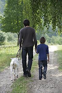 Mind Body Soul - father and son walking with goat