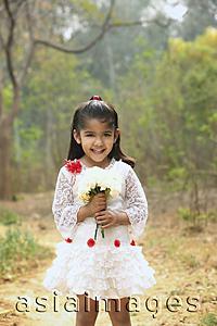 Asia Images Group - Little girl in white dress holding bouquet (vertical)