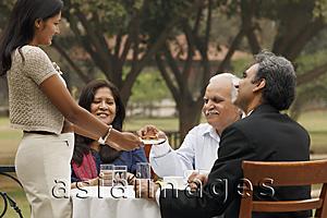 Asia Images Group - family having meal outdoors