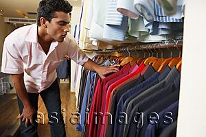 Asia Images Group - man shopping for shirts