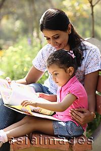 Asia Images Group - Mother and daughter with book