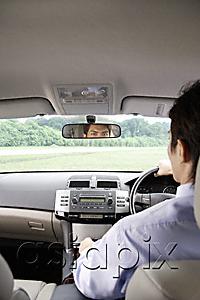 AsiaPix - Man driving in car