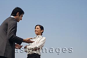 Asia Images Group - woman and man discussing business (horizontal)