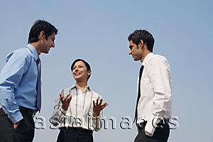 Asia Images Group - three business colleagues, conversing