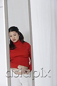 AsiaPix - Pregnant woman measuring stomach