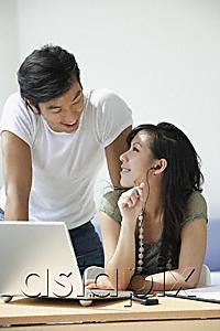 AsiaPix - Young couple working at computer