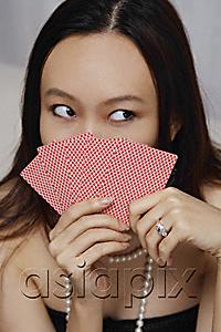 AsiaPix - Young woman holding game cards