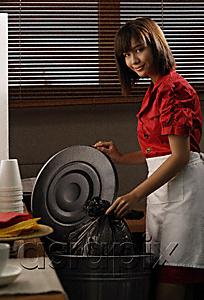 AsiaPix - Waitress in diner taking out trash