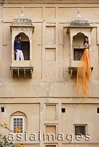 Asia Images Group - man and women on balconies, woman in sari