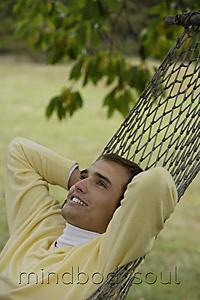 Mind Body Soul - Young man resting in hammock