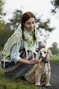 Mind Body Soul - Young woman petting dog