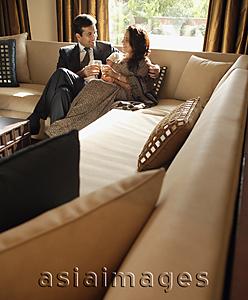 Asia Images Group - couple sitting on couch