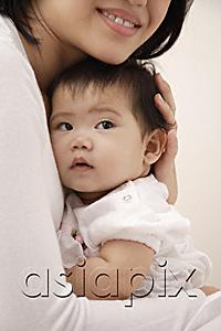 AsiaPix - Woman holding baby girl