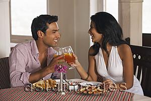 Asia Images Group - couple toasting in cafe