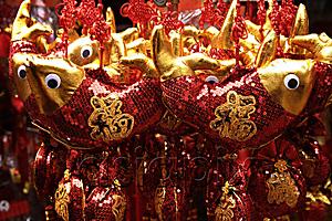 AsiaPix - Still life of hanging decorations of fish with Chinese character for 
