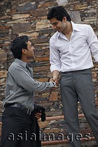 Asia Images Group - men shaking hands