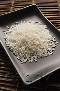 AsiaPix - grains of uncooked rice on a square dish