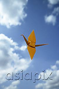 AsiaPix - single yellow paper crane against sky backdrop