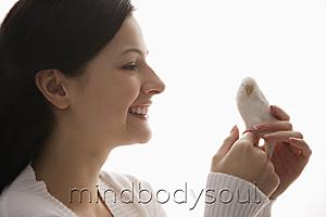 Mind Body Soul - woman holding tiny bird
