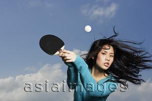Asia Images Group - young lady holding ping pong bat