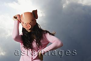 Asia Images Group - lady with pig mask