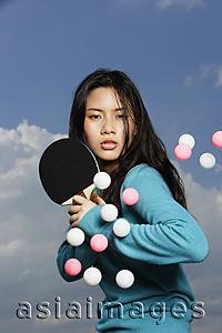 Asia Images Group - young lady ready to hit ping pong balls