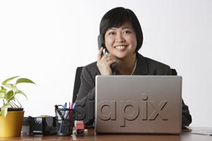 AsiaPix - woman sitting at desk talking on phone