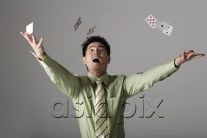 AsiaPix - man throwing cards up into the air
