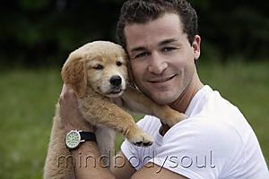 Mind Body Soul - man holding puppy