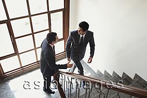Asia Images Group - businessmen walking up the stairs