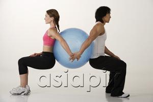 AsiaPix - Couple working out with exercise ball