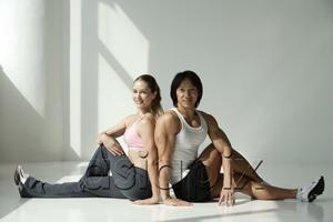 AsiaPix - Man and woman stretching for work out