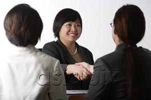 AsiaPix - business woman shaking hands