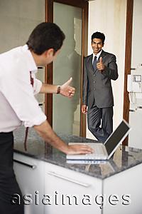 Asia Images Group - businessmen giving 