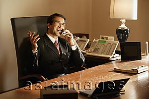 Asia Images Group - businessman in office, on phone