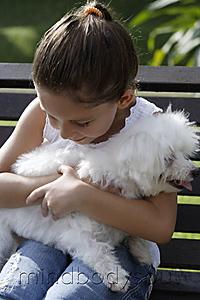 Mind Body Soul - young girl hugging little white dog