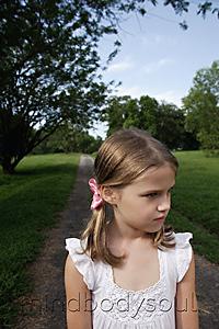 Mind Body Soul - young girl standing on country road