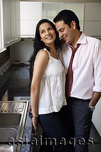 Asia Images Group - young couple in kitchen