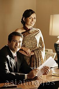 Asia Images Group - couple in office, woman in sari