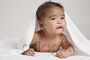 AsiaPix - Happy Chinese baby with blanket over his head.