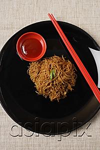 AsiaPix - Noodles on plate with chopsticks.