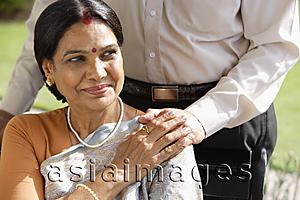 Asia Images Group - portrait of woman with hand on man's hand