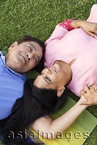 Asia Images Group - couple lying on the grass