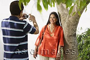 Asia Images Group - man taking photograph of woman